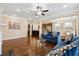 Open living room with hardwood floors and a view into the kitchen at 4705 Sanderling St, Cumming, GA 30041