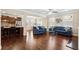 Open living room with hardwood floors and kitchen view at 4705 Sanderling St, Cumming, GA 30041