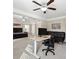 Bright home office with standing desk and built-in seating at 4705 Sanderling St, Cumming, GA 30041