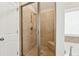 Spacious walk-in shower with tiled walls and seat at 4705 Sanderling St, Cumming, GA 30041