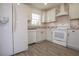 Modern kitchen with white cabinets, granite counters, and stainless steel appliances at 216 Jordan Ln, Carrollton, GA 30116