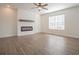 Bright living room featuring a modern fireplace and wood-look flooring at 216 Jordan Ln, Carrollton, GA 30116