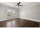 Spacious bedroom with hardwood floors, ceiling fan, and large window at 3213 Woodlynne Way, Atlanta, GA 30340