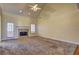 Living room with fireplace, vaulted ceiling and door to patio at 216 Chad Ln, Loganville, GA 30052