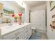 Bright bathroom with double sink vanity, a framed mirror, floral shower curtain, and neutral paint at 3430 Summerpoint Xing, Cumming, GA 30028