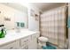 A well-lit bathroom boasts a single sink, shower-tub combination, and modern fixtures at 3430 Summerpoint Xing, Cumming, GA 30028