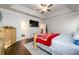 Bright main bedroom with tray ceilings, wood floors, a ceiling fan and ensuite bathroom at 3430 Summerpoint Xing, Cumming, GA 30028