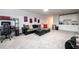Bonus room with carpet, TV, kitchenette, seating, and ample space for entertainment or hobbies at 3430 Summerpoint Xing, Cumming, GA 30028