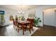 Well-lit dining area with table set for six, adjacent to patio doors and open space at 3430 Summerpoint Xing, Cumming, GA 30028