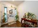 Inviting entryway with hardwood floors, decorated with plants, flowers, and a bright, cheerful ambiance at 3430 Summerpoint Xing, Cumming, GA 30028