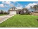 Two-story house with stone accents and a landscaped lawn at 3430 Summerpoint Xing, Cumming, GA 30028