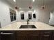 Kitchen island with granite countertop, sink, and copper pendant lights at 18 Peachtree Ne Ave # 1, Atlanta, GA 30305