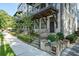 Row of townhouses with white brick exteriors, landscaping, and individual entrances at 18 Peachtree Ne Ave # 1, Atlanta, GA 30305