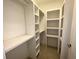 Spacious walk-in closet with built-in shelving at 18 Peachtree Ne Ave # 1, Atlanta, GA 30305