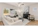 Bright living room featuring a cozy white sofa, modern art, and plenty of natural light, great for relaxing at 1112 Edinberg Dr # 57, Villa Rica, GA 30180