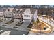 Luxury townhome community, aerial view showcasing homes and landscaping at 1 Ganel Ln, Alpharetta, GA 30009