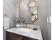 Elegant powder room with marble vanity and gold accents at 1 Ganel Ln, Alpharetta, GA 30009