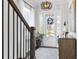 Bright and airy entryway with hardwood floors, staircase, and natural light at 1 Ganel Ln, Alpharetta, GA 30009