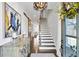 Bright entryway with hardwood floors, staircase, and decorative console table at 1 Ganel Ln, Alpharetta, GA 30009