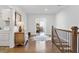 Upstairs hallway with hardwood floors, built-in dresser, and access to bedrooms at 1 Ganel Ln, Alpharetta, GA 30009