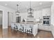 Modern kitchen with white cabinets, stainless steel appliances, and an island at 1 Ganel Ln, Alpharetta, GA 30009