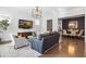 Bright living room with hardwood floors and views into dining area at 1 Ganel Ln, Alpharetta, GA 30009