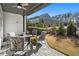 Cozy covered patio with fire pit and seating area at 1 Ganel Ln, Alpharetta, GA 30009