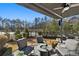 Relaxing covered patio with fire pit and comfortable seating at 1 Ganel Ln, Alpharetta, GA 30009