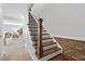 Elegant staircase with wood and metal accents at 1 Ganel Ln, Alpharetta, GA 30009