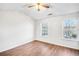 Spacious bedroom with hardwood floors and two large windows at 273 Devonshire Dr, Alpharetta, GA 30022