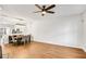 Open dining area with hardwood floors, ceiling fan, and kitchen view at 273 Devonshire Dr, Alpharetta, GA 30022