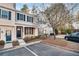 Two story townhome with brick and siding, front porch, and landscaping at 273 Devonshire Dr, Alpharetta, GA 30022