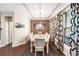 Bright dining room with decorative window curtains and hardwood floors at 3155 Boldmere Se Trl # 3, Smyrna, GA 30080