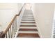 Elegant staircase with dark wood treads and iron railing at 3155 Boldmere Se Trl # 3, Smyrna, GA 30080