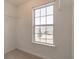 Walk-in closet with window and wire shelving at 520 Dragonfly Ct, Cumming, GA 30040