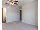 Simple bedroom with ceiling fan, carpeting, and ensuite bathroom at 520 Dragonfly Ct, Cumming, GA 30040