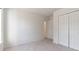 Bright bedroom featuring a large closet and neutral walls at 520 Dragonfly Ct, Cumming, GA 30040