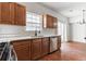 Modern kitchen with stainless steel appliances and light wood cabinets at 520 Dragonfly Ct, Cumming, GA 30040