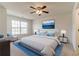 Spacious main bedroom with a king-size bed and ceiling fan at 520 Dragonfly Ct, Cumming, GA 30040