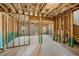 Unfinished basement featuring wood framing and natural light at 1356 Lucan Ln # Wc226, Lawrenceville, GA 30043
