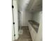 Bathroom featuring double sinks with granite countertops and a glass-enclosed shower at 1356 Lucan Ln # Wc226, Lawrenceville, GA 30043