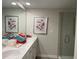 Bathroom with double sinks, granite counters, and a glass enclosed shower with tile surround at 1356 Lucan Ln # Wc226, Lawrenceville, GA 30043