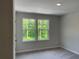 Bedroom with two windows offering natural light and green views at 1356 Lucan Ln # Wc226, Lawrenceville, GA 30043