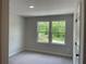 Bedroom showcasing dual windows overlooking a lush landscape at 1356 Lucan Ln # Wc226, Lawrenceville, GA 30043