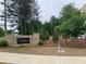 Landscaped community sign for The Collections at Wolf Creek at 1356 Lucan Ln # Wc226, Lawrenceville, GA 30043