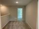 Bright hallway with neutral paint, carpet flooring, and access to additional rooms at 1356 Lucan Ln # Wc226, Lawrenceville, GA 30043