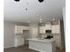 Modern kitchen showcasing white cabinetry, stainless steel appliances, and a center island at 1356 Lucan Ln # Wc226, Lawrenceville, GA 30043