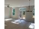 Sunlit living room featuring hardwood floors and french doors at 1356 Lucan Ln # Wc226, Lawrenceville, GA 30043