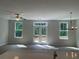 Open living space with abundant natural light and doors leading to an outdoor deck at 1356 Lucan Ln # Wc226, Lawrenceville, GA 30043