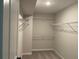 Spacious walk-in closet with metal shelving, providing ample storage space at 1356 Lucan Ln # Wc226, Lawrenceville, GA 30043